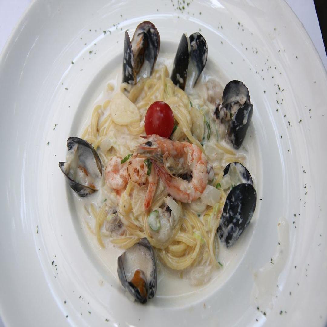 Elegant seafood pasta vongole in white wine sauce